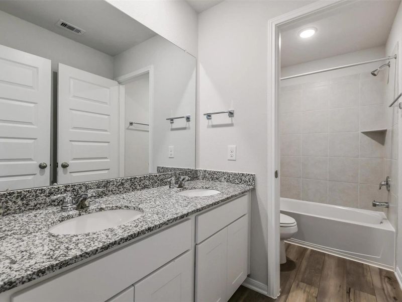 Furnished interior view inside a new home in Caney Creek Place, Conroe (Image 13).