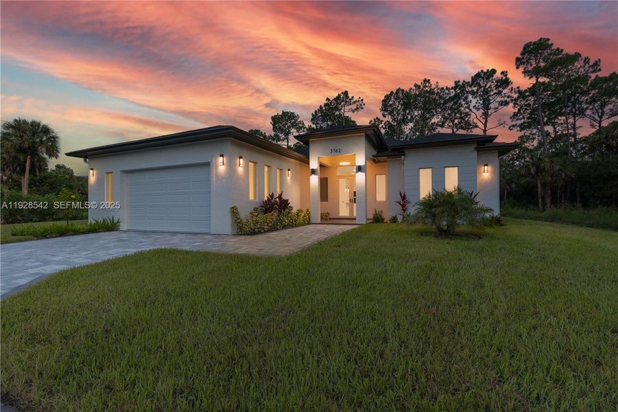 Front exterior of a new home in , Naples, FL, highlighting curb appeal (Image 20). Front exterior of a new home in , Naples, FL, highlighting curb appeal (Image 20).