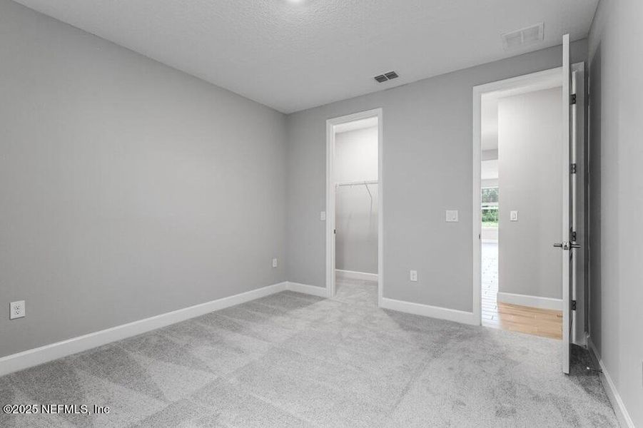 Spacious, unfurnished interior of a new home in Colbert Landings, Palm Coast (Image 32).