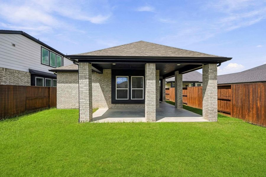 Exterior details and patio area of a home in Meridiana, Iowa Colony (Image 4).