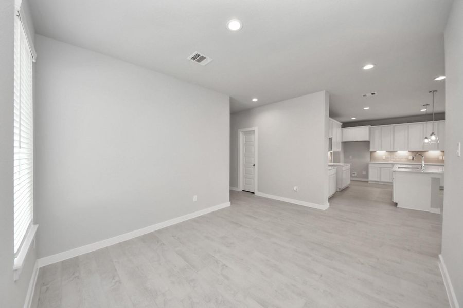 Take another look at the expansive dining space that seamlessly connects with the kitchen. Sample photo of completed home with similar floor plan. Actual colors and selections may vary. Take another look at the expansive dining space that seamlessly connects with the kitchen. Sample photo of completed home with similar floor plan. Actual colors and selections may vary.