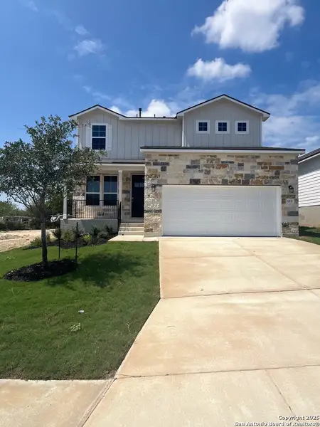 Front exterior of a new home in Weston Oaks, San Antonio, TX, highlighting curb appeal (Image 1).