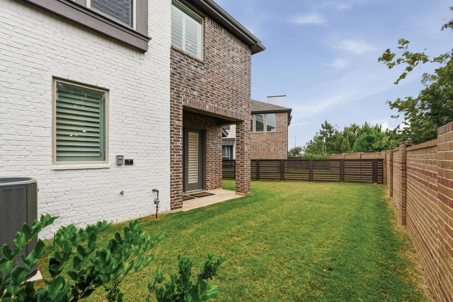 Exterior details and patio area of a home in Bridgeland Central, Cypress (Image 3).