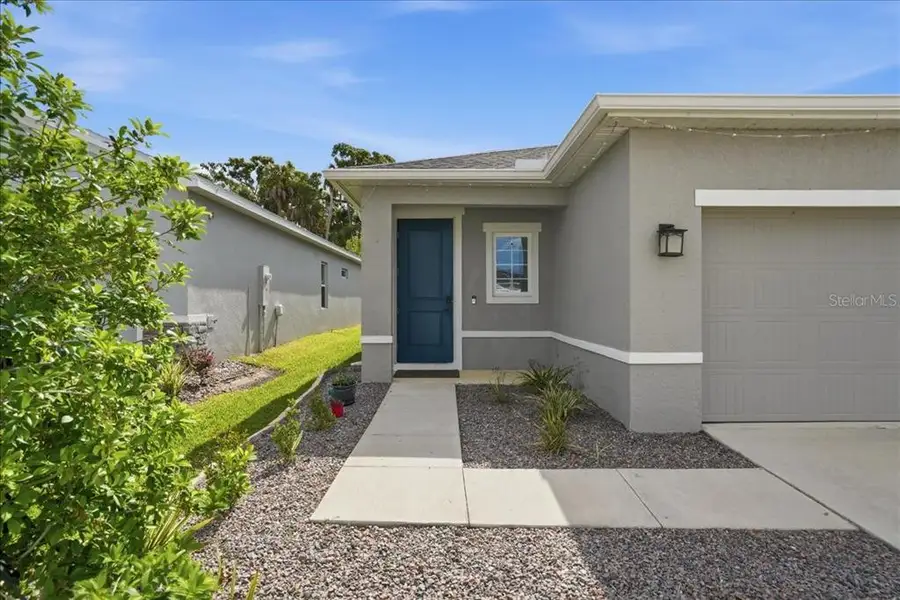Exterior details and patio area of a home in , Parrish (Image 3).
