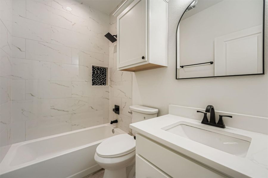 Full bathroom 2 featuring shower / bathtub combination and vanity Full bathroom 2 featuring shower / bathtub combination and vanity