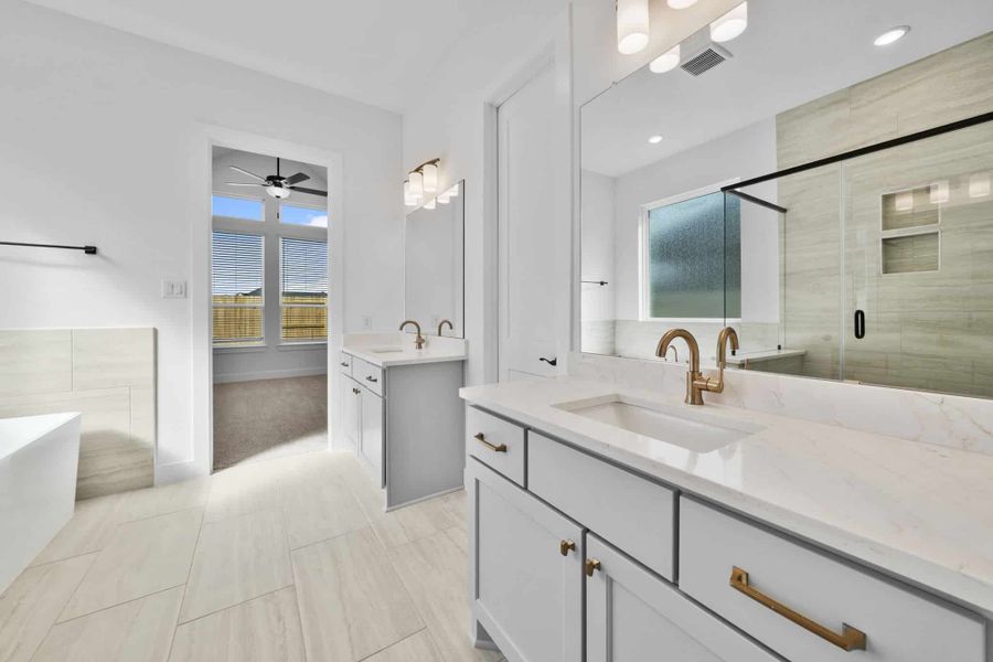 Representative furnished interior of a home built from the Summerton by Chesmar Homes in Grange, Katy (Image 9).