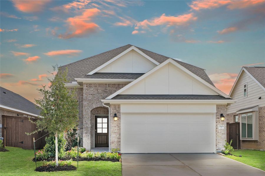 Front exterior of a new home in The Trails, New Caney, TX, highlighting curb appeal (Image 22).