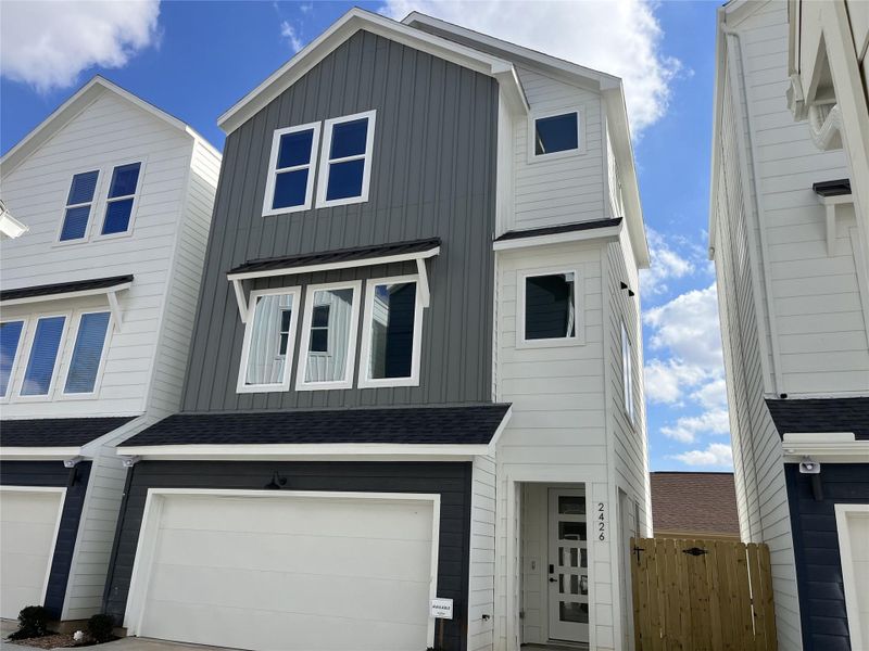 The striking façade is 2426 Freeman St., one of the six homes in the community. It showcases a modern three-story design, offering 3 bedrooms, 3.5 bathrooms, and a dedicated study, with clean lines and contemporary architecture that reflect stylish urban living.