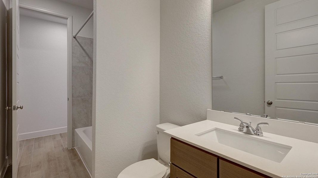 Furnished interior view inside a new home in Ladera 45', San Antonio (Image 11).