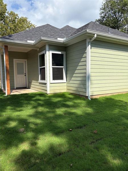 Front exterior of a new home in , Denison, TX, highlighting curb appeal (Image 16). Front exterior of a new home in , Denison, TX, highlighting curb appeal (Image 16).