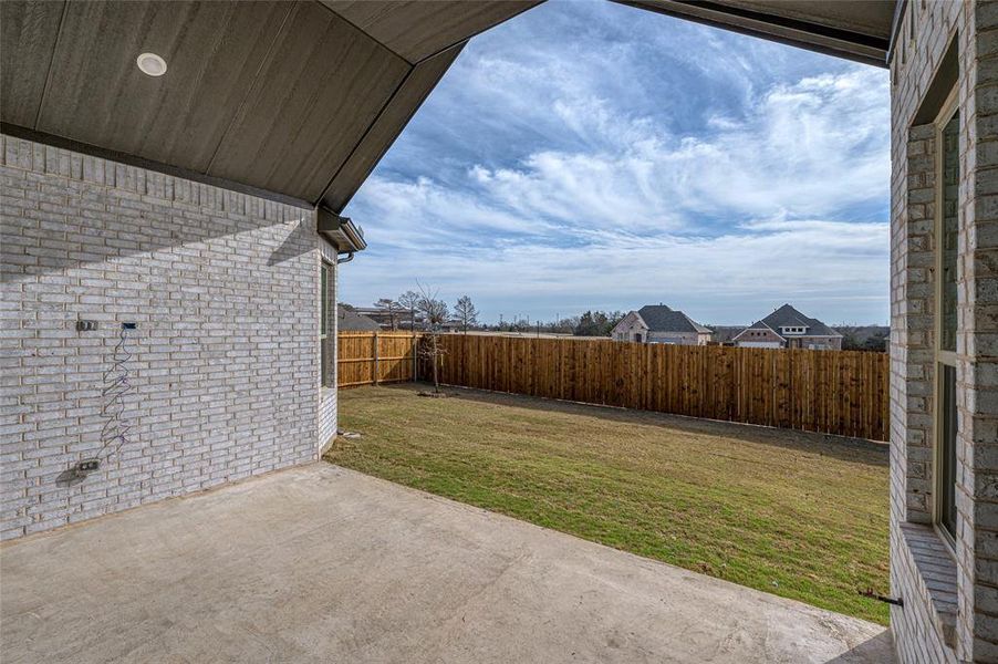 Exterior details and patio area of a home in Estates At Baker Park, Sherman (Image 20).