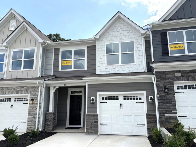 Front exterior of a new home in Riverbrooke Townhomes, Simpsonville, SC, highlighting curb appeal (Image 1). Front exterior of a new home in Riverbrooke Townhomes, Simpsonville, SC, highlighting curb appeal (Image 1).
