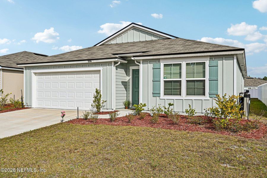 Front exterior of a new home in Cross Creek Express, Green Cove Springs, FL, highlighting curb appeal (Image 22).