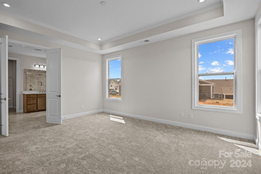 Easy access from Primary bedroom through classic french doors to the stunning Primary "spa like" bath.