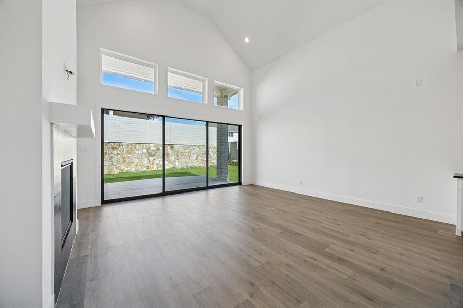 You'll enjoy beautiful outdoor views from the wall of windows in your spacious family room.