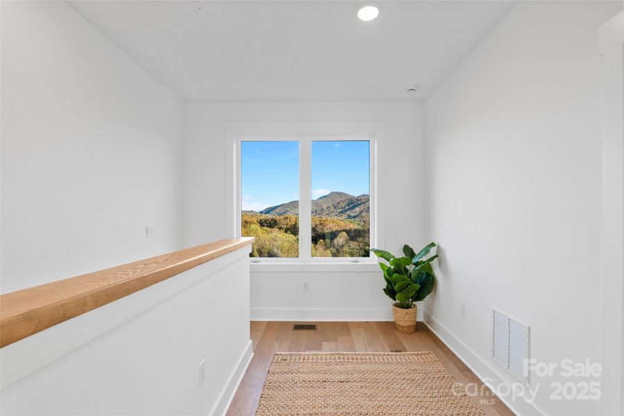 Upstairs landing with mountain views Upstairs landing with mountain views