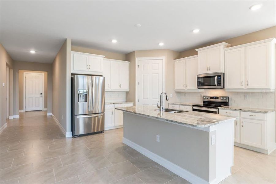 Furnished interior view inside a new home in Deep Creek Tradition Series, Punta Gorda (Image 6).