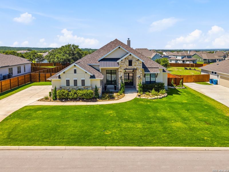 Front exterior of a new home in Megan's Landing, Castroville, TX, highlighting curb appeal (Image 22). Front exterior of a new home in Megan's Landing, Castroville, TX, highlighting curb appeal (Image 22).