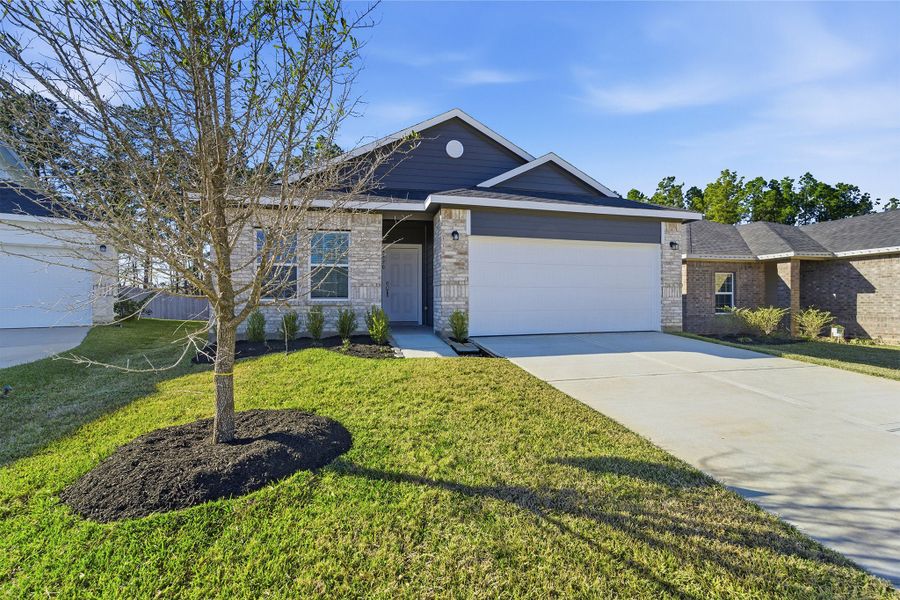 Front exterior of a new home in Magnolia Springs, Montgomery, TX, highlighting curb appeal (Image 25).