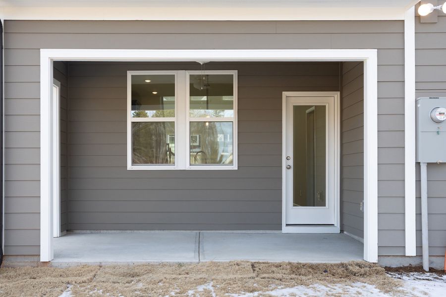 Exterior details and patio area of a home in Ovation at Sweetbrier, Durham (Image 3).