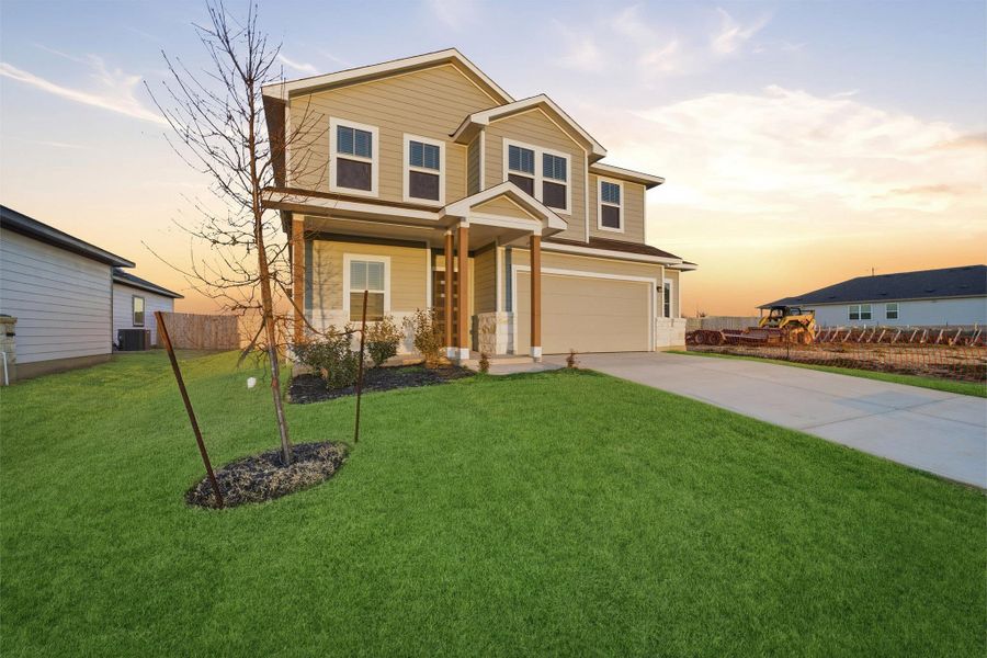 Front exterior of a new home in Hunters Glen, Jarrell, TX, highlighting curb appeal (Image 2).