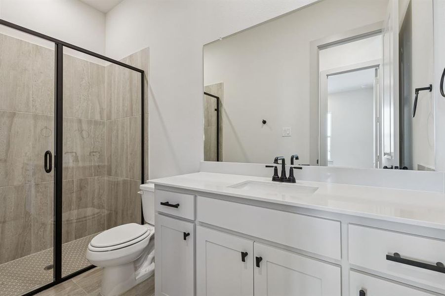 Friends and family will feel right at home in either of the beautifully finished guest baths in our Bella plan.