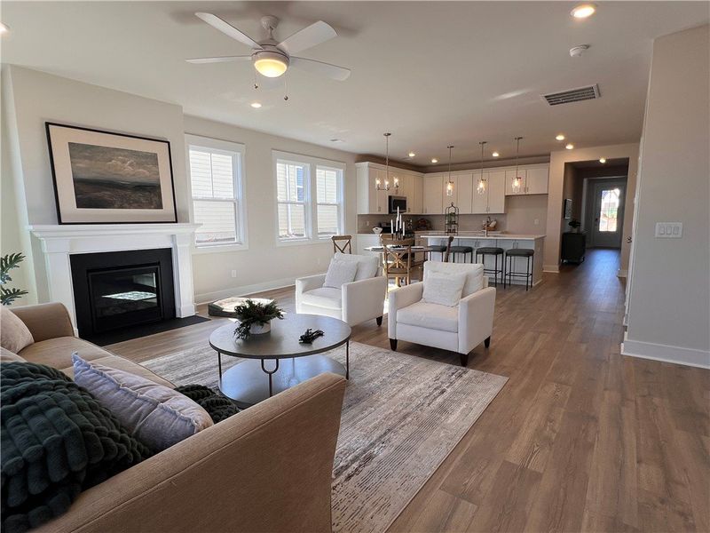 Bright and airy open-concept living area with a fi Bright and airy open-concept living area with a fi