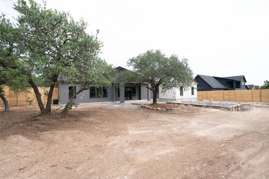 Front exterior of a new home in , Wimberley, TX, highlighting curb appeal (Image 18). Front exterior of a new home in , Wimberley, TX, highlighting curb appeal (Image 18).