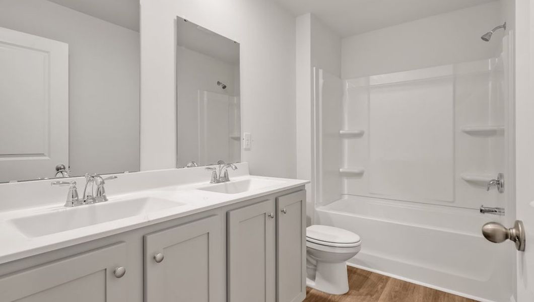 Representative furnished interior of a home built from the GLYNN by D.R. Horton in Grayson Park, Leland (Image 11).
