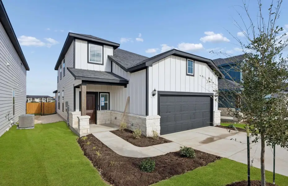 Front exterior of a new home in Cameron Place, Austin, TX, highlighting curb appeal (Image 20).