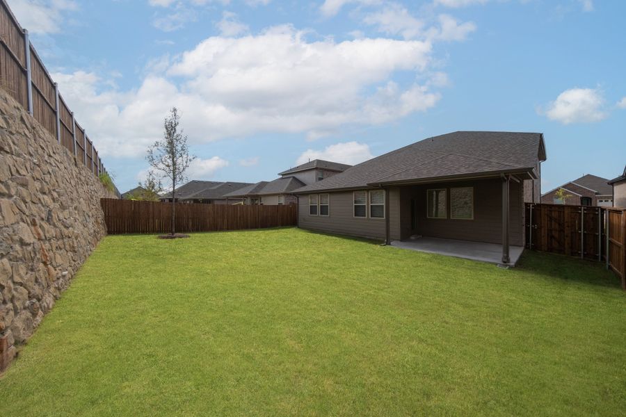 Exterior details and patio area of a home in The Villages of Hurricane Creek, Anna (Image 2).