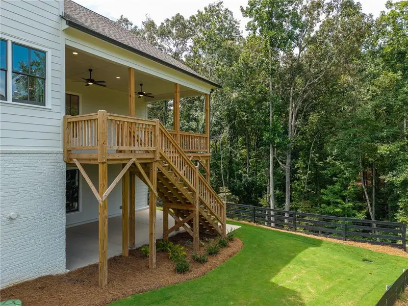 Exterior details and patio area of a home in Malone's Pond, Ball Ground (Image 23).