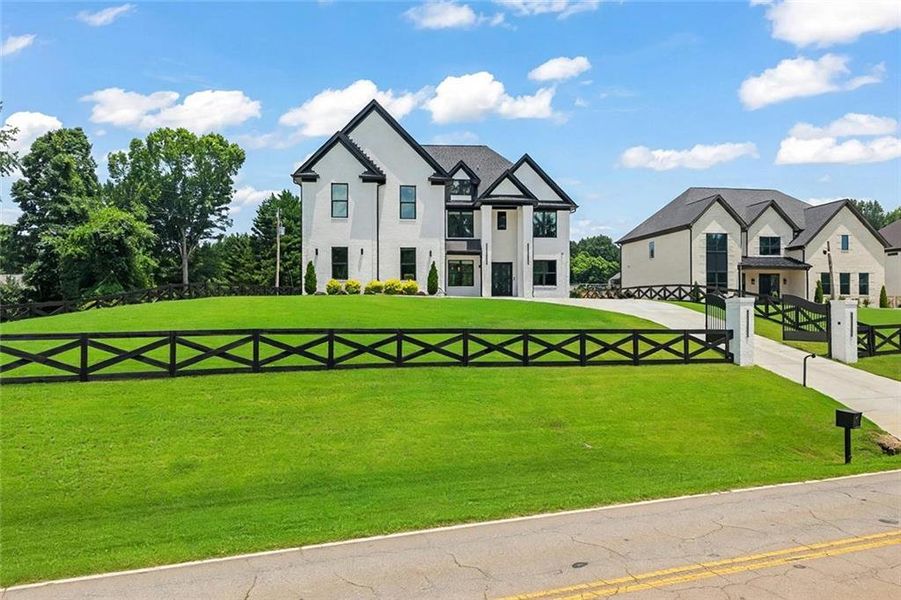 Front exterior of a new home in , Braselton, GA, highlighting curb appeal (Image 31).