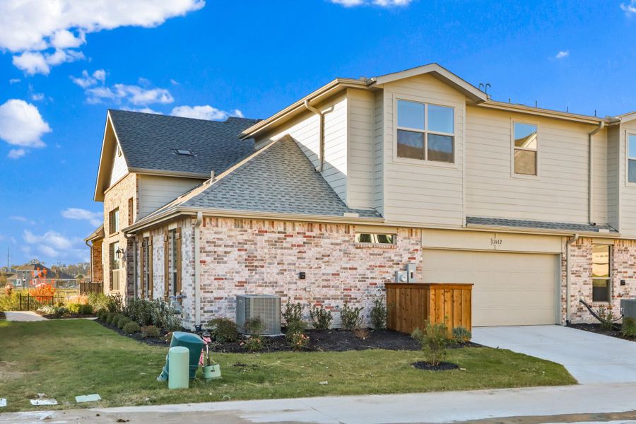 Front exterior of a new home in Cottonwood Creek, Rowlett, TX, highlighting curb appeal (Image 19).