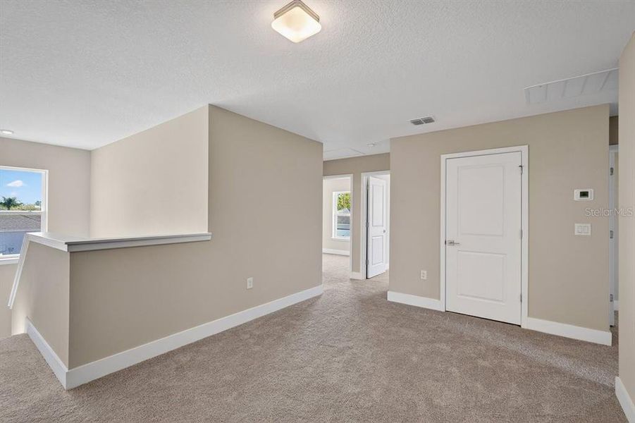 Spacious, unfurnished interior of a new home in Gray Hawk at Hole Two, Daytona Beach (Image 35).