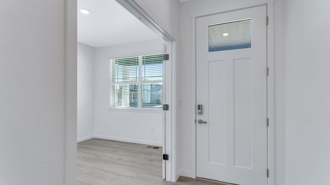 Representative unfurnished interior of a home built from the Calhan by D.R. Horton in Vantage, Berthoud (Image 12).