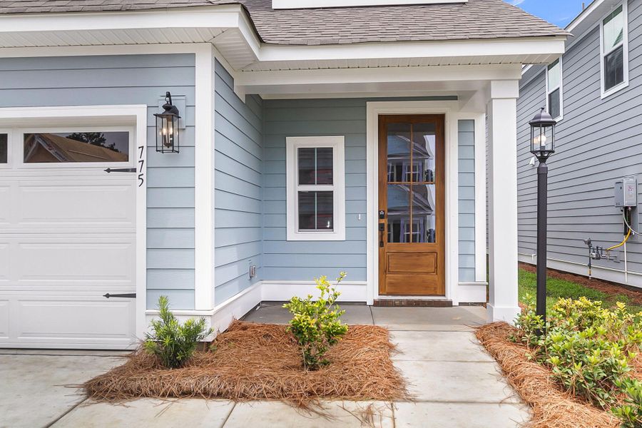 Front exterior of a new home in High Point at Foxbank, Moncks Corner, SC, highlighting curb appeal (Image 1).