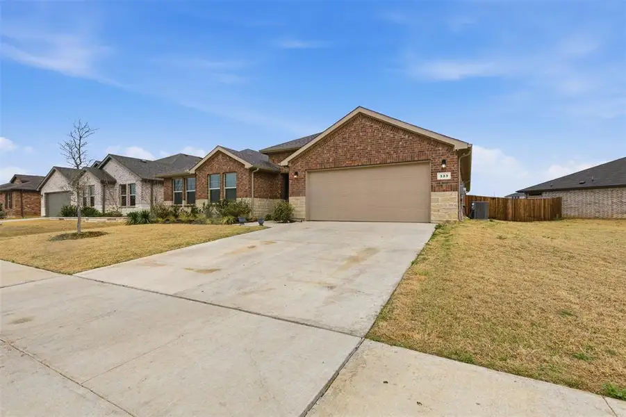 Front exterior of a new home in , Burleson, TX, highlighting curb appeal (Image 23).