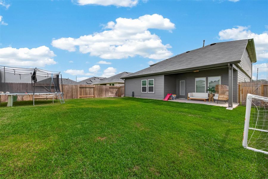 Exterior details and patio area of a home in Grand Pines, Magnolia (Image 28).