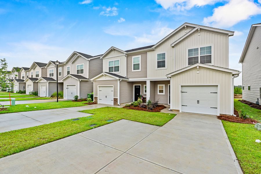 Front exterior of a new home in Hunters Branch Townhomes, Hopkins, SC, highlighting curb appeal (Image 2).