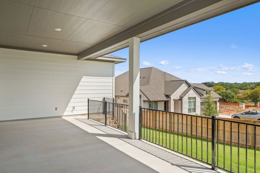 Exterior details and patio area of a home in Capitol Collection at Lariat, Liberty Hill (Image 2).