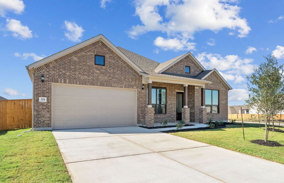Front exterior of a new home in 6 Creeks, Kyle, TX, highlighting curb appeal (Image 23). Front exterior of a new home in 6 Creeks, Kyle, TX, highlighting curb appeal (Image 23).