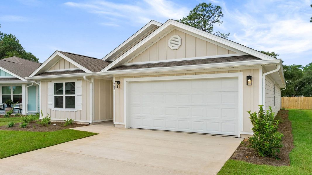 Front exterior of a new home in Ashton Park Phase III, Freeport, FL, highlighting curb appeal (Image 2).