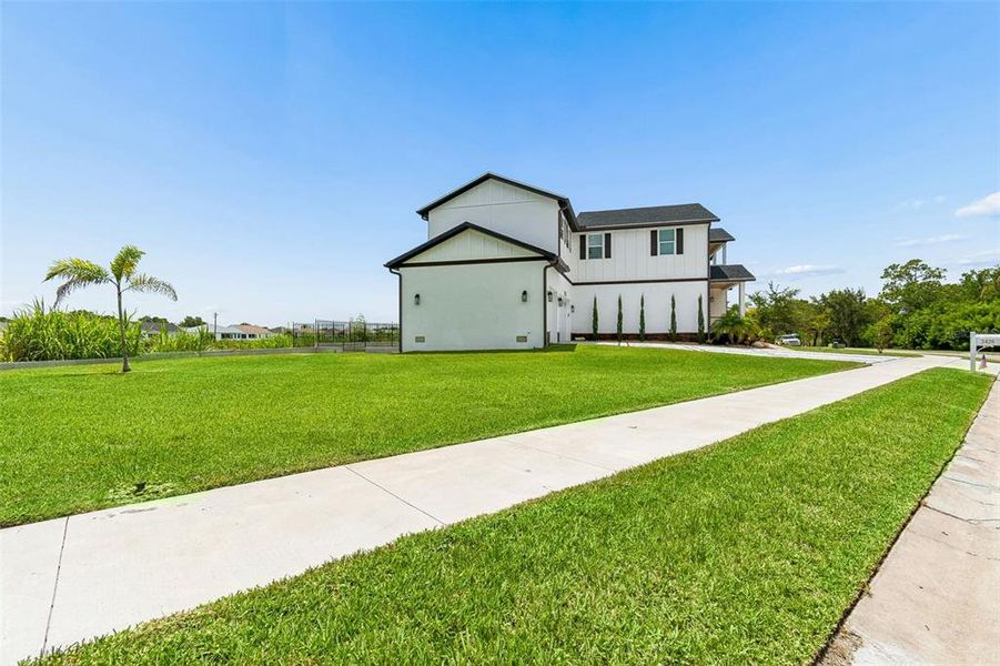 Front exterior of a new home in , Safety Harbor, FL, highlighting curb appeal (Image 32). Front exterior of a new home in , Safety Harbor, FL, highlighting curb appeal (Image 32).