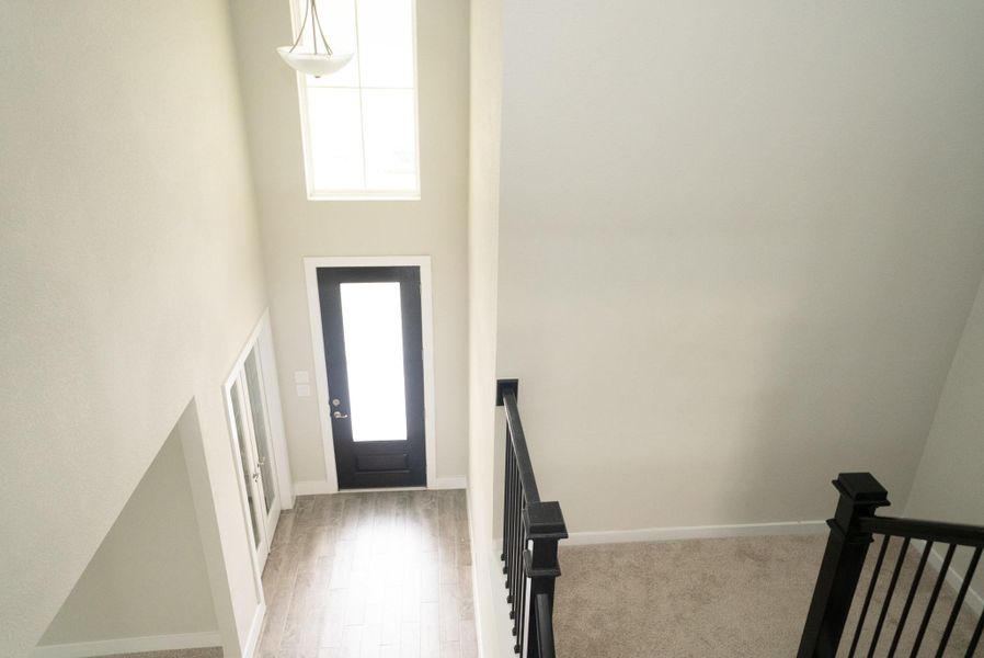 Spacious, unfurnished interior of a new home in Sunterra, Katy (Image 24).