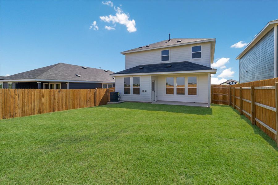 Front exterior of a new home in Marigold, Uhland, TX, highlighting curb appeal (Image 14). Front exterior of a new home in Marigold, Uhland, TX, highlighting curb appeal (Image 14).