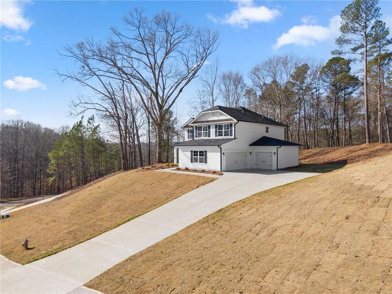 Front exterior of a new home in The Fields of Walnut Creek, Pendergrass, GA, highlighting curb appeal (Image 19).