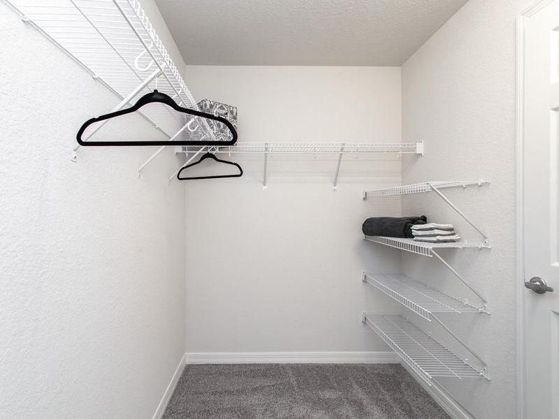 Walk-in wardrobe in the owner`s suite - Remy home plan by Highland Homes