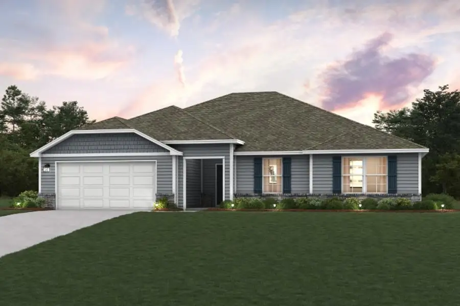 A house with a lawn in front of it. A house with a lawn in front of it.