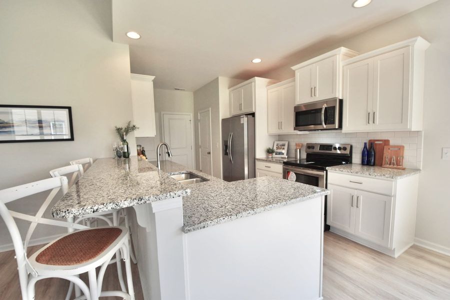 Representative furnished interior of a home built from the Danforth by Stevens Fine Homes in River Hills, Shallotte (Image 8).